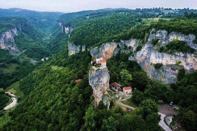 Kutaisi:Chiatura Tour with Katskhi Pillar & Cable Car Experience - Mghvimevi Cave Monastery and the climb into the rock