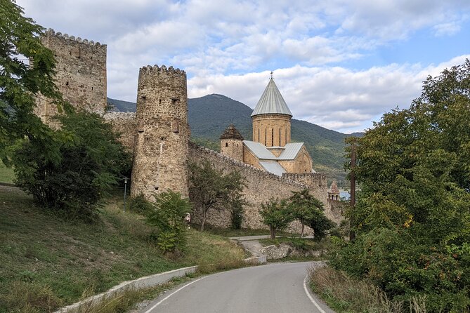 Private Full Day Trip to Kazbegi Mountains - The Georgia-Russia Friendship Monument above the valley